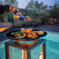 Brasero d’ambiance aux pellets avec plancha de cuisson Roma